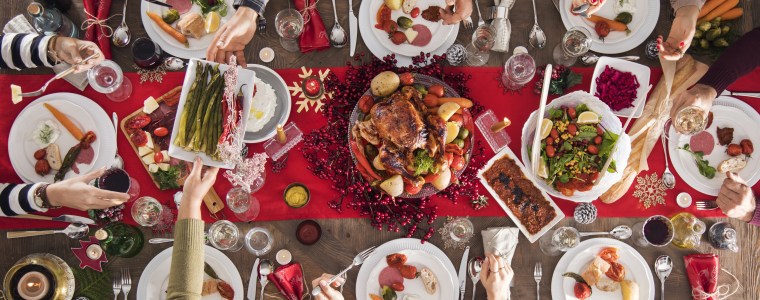 Photograph of large dinning table set for Christmas dinner