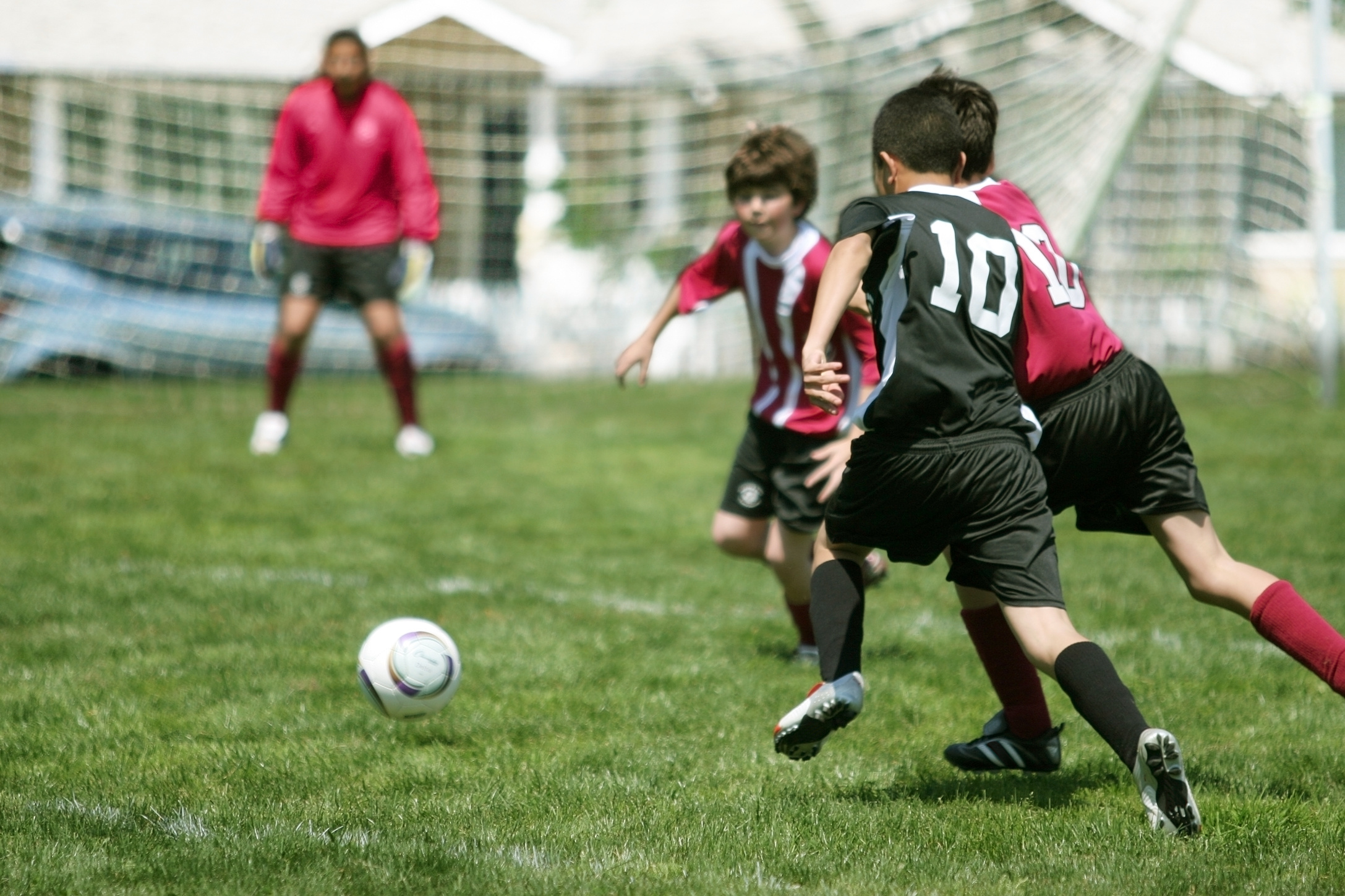 Photograph of boys playing soccer