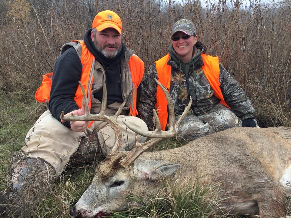 Photograph of Aaron Sedberry and Dr. Sedberry with a deer he shot.